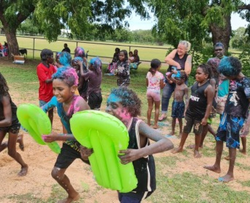 Children playing with water toys in Warruwi