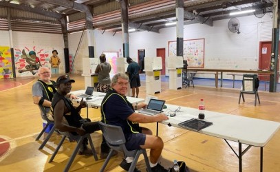 Happy people manning the polling booths