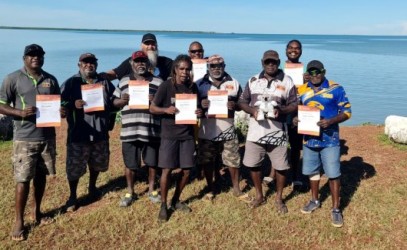 Smiling men who have completed a first aid course 