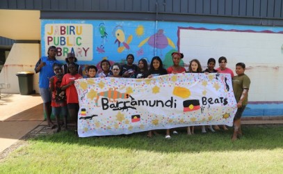 Young people in Jabiru holding up a banner that says Barramundi Beats