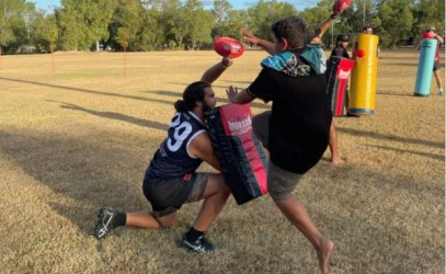 Kids in Jabiru playing Aus Kick 