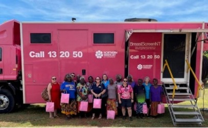 Minjilang ladies out the front of the  pink breast screen bus 
