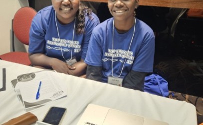 Two smiling girls taking part in a leadership course