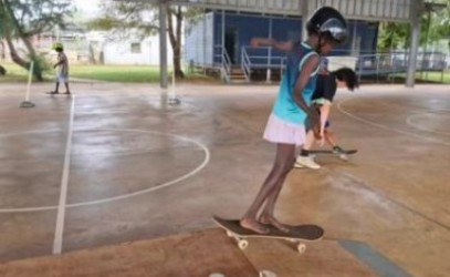 Children practicing skateboarding in Gunbalanya
