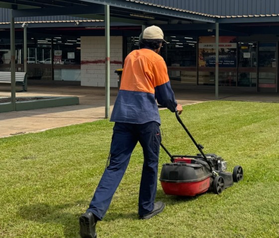 Tyson mowing lawn