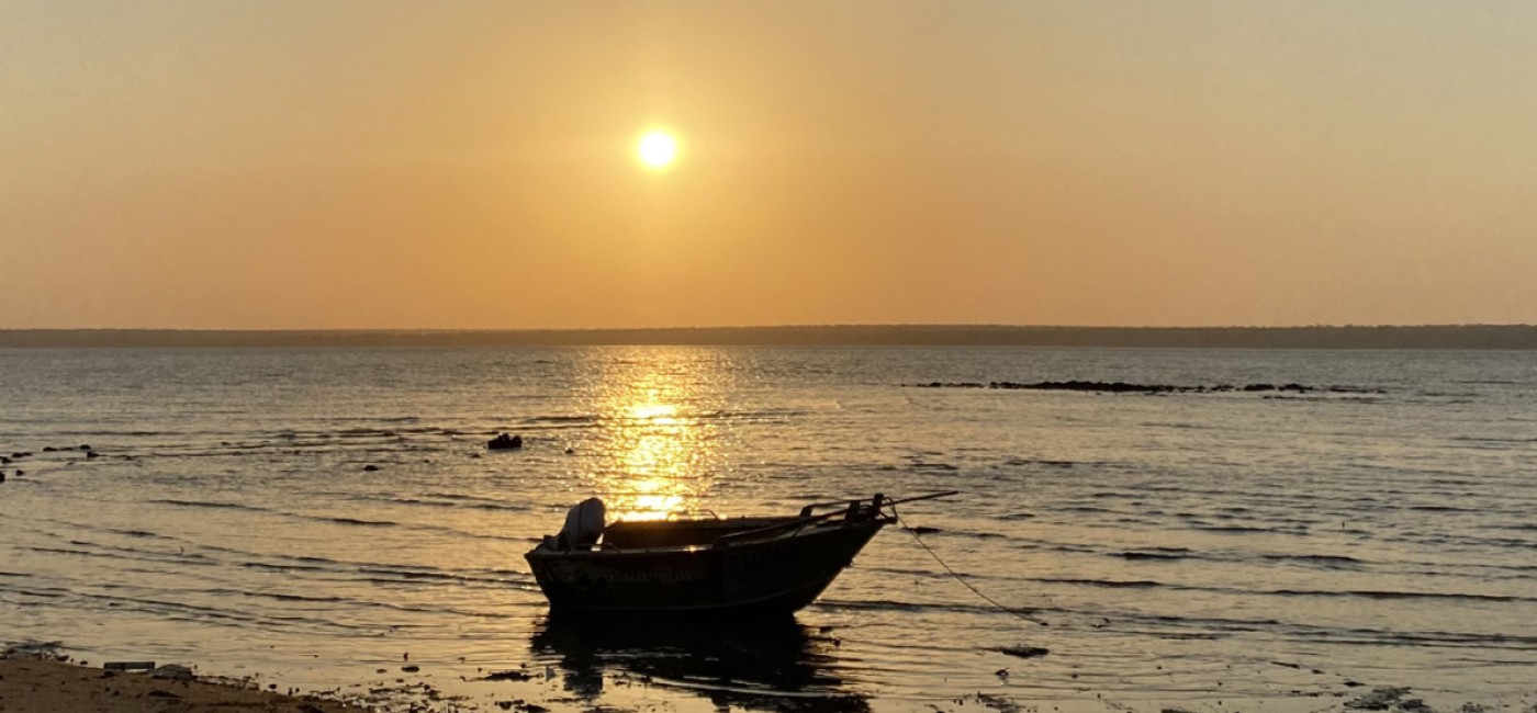 A boat on the ocean in Maningrida at sunset