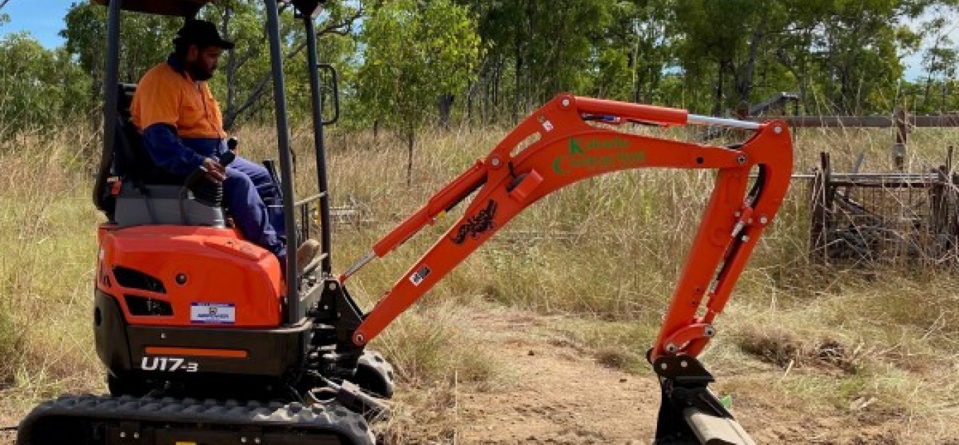 Man operating an excavator