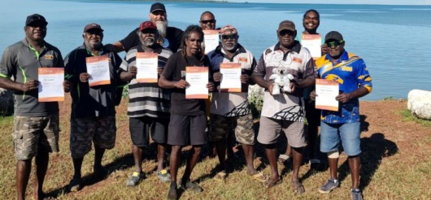 Smiling men who have completed a first aid course 