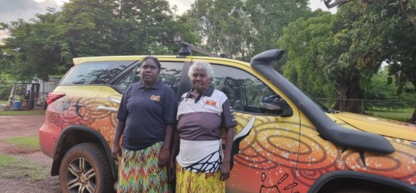 New warruwi community safety night patrol team standing out the front of their car