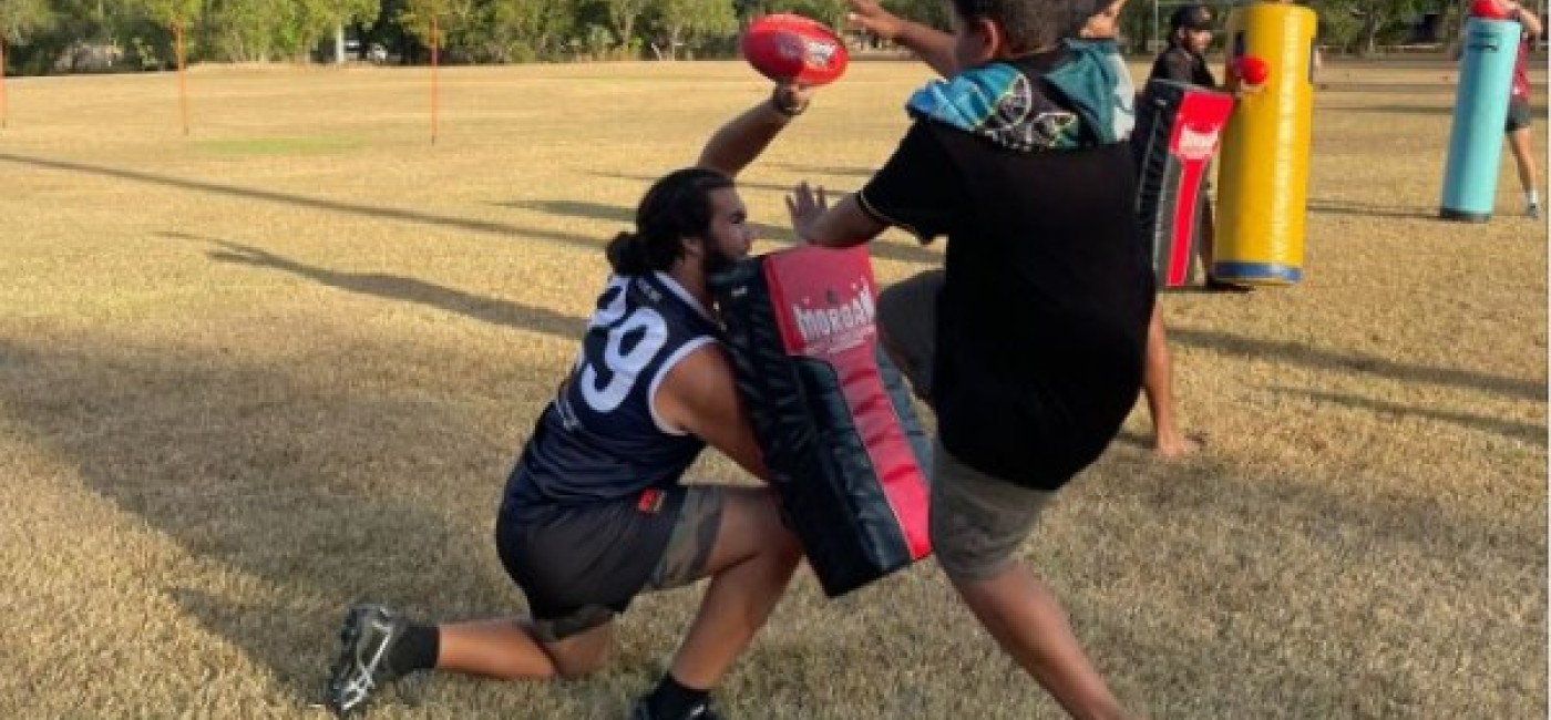 Kids in Jabiru playing Aus Kick 