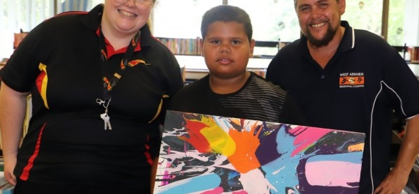 Jabiru art competition winners smiling at the camera