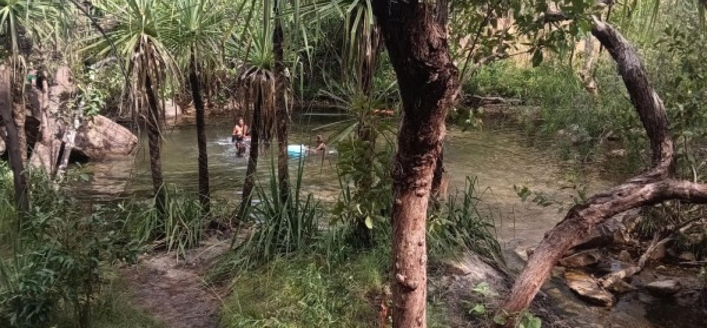 People enjoying swimming in a waterhold in Gunbalanya