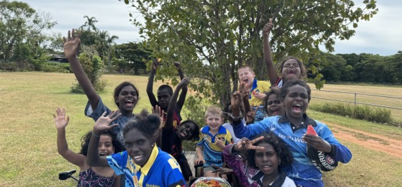 Smiling children having a break at football training 